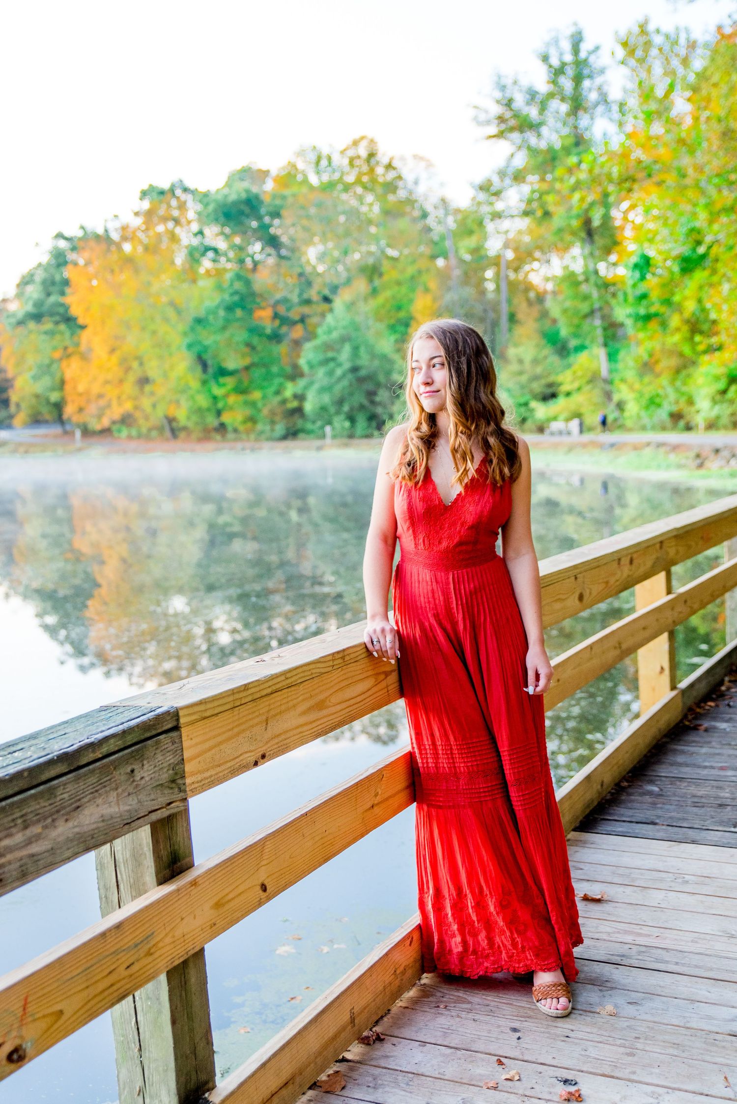 high school senior pictures on a bridge in Chicago Park in the fall