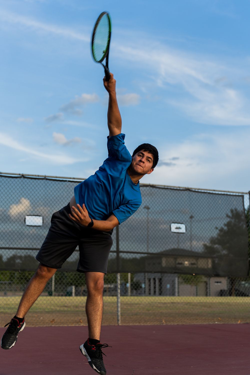 Tennis court with racket in Texas at Bee Creek, captured by a sports photographer.