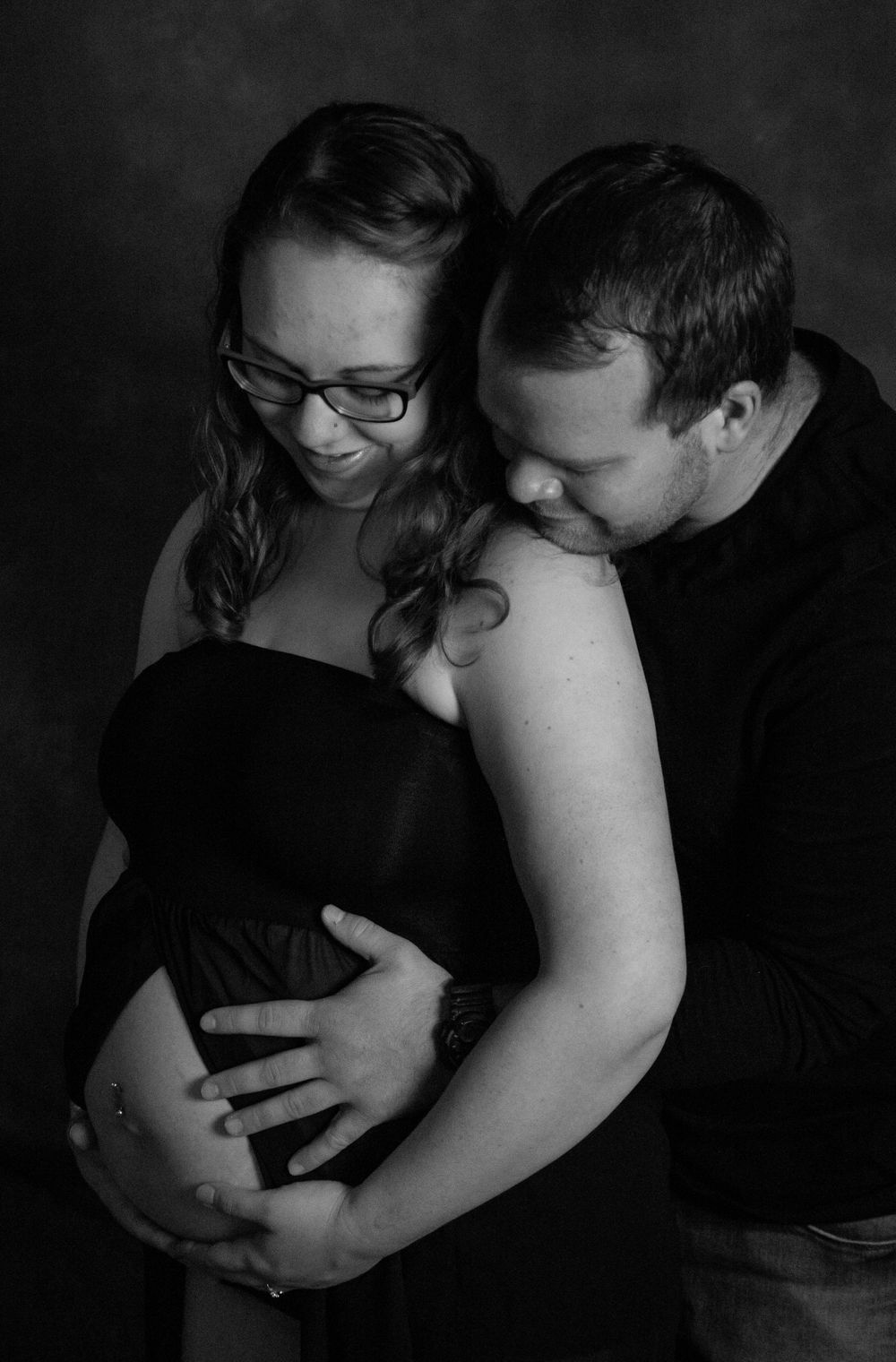 black and white maternity photo of couple in love