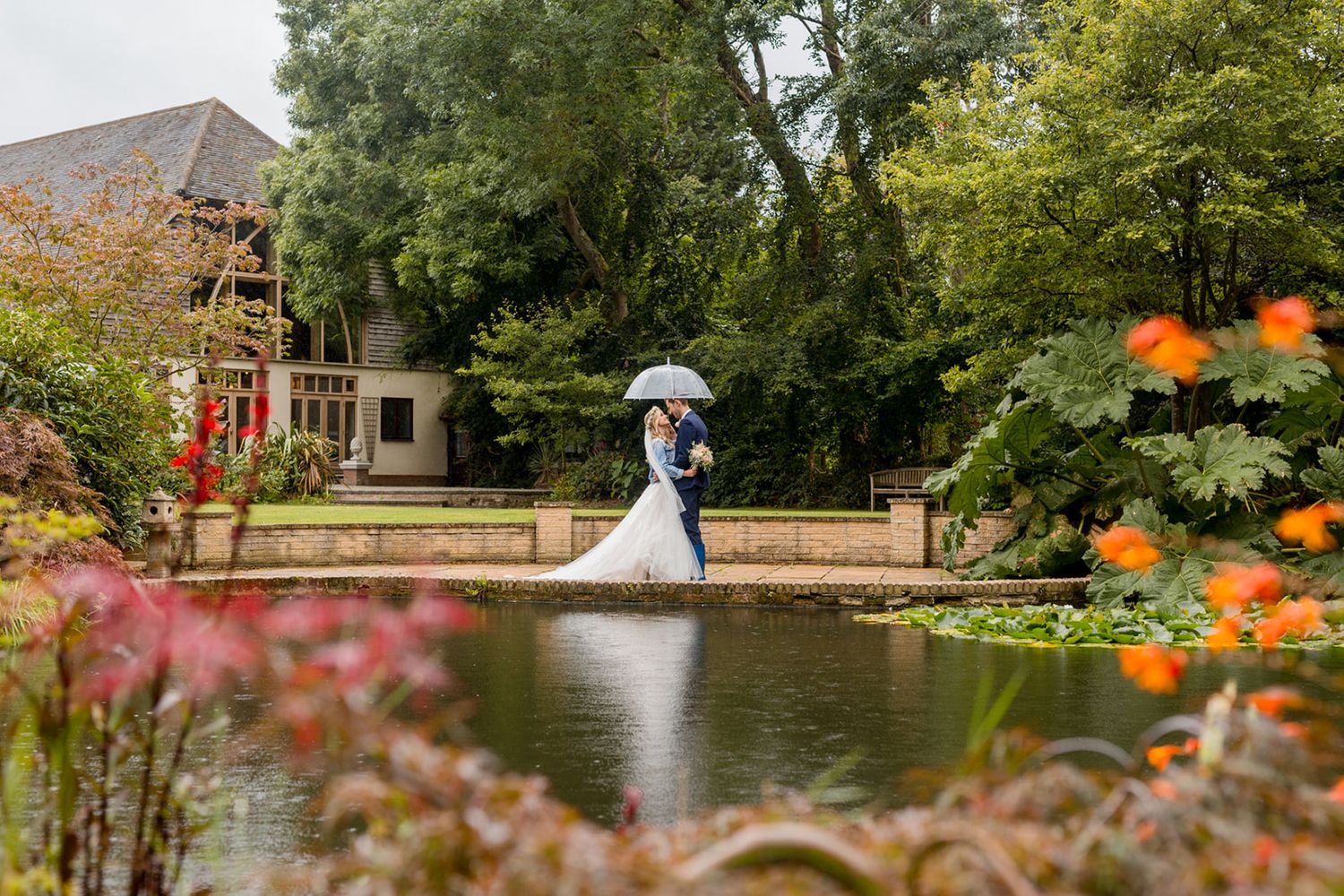 rivervale barn lake with bride and groom