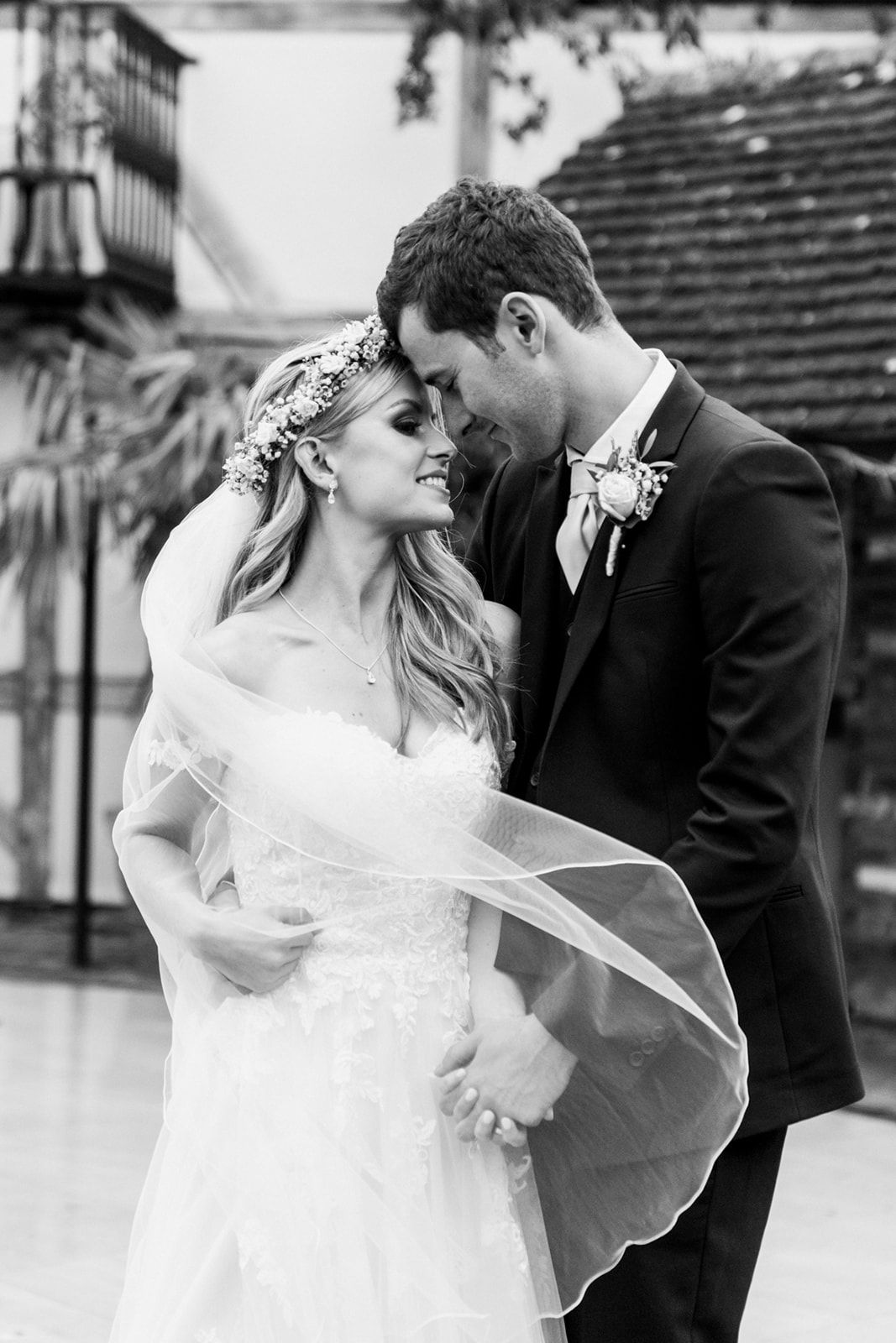 intimate black and white photograph of wedding couple