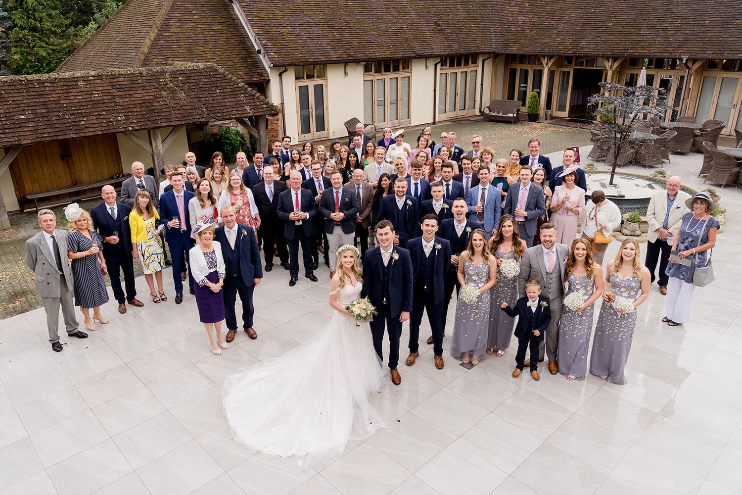 big group photo in court yard of Rivervale Barn
