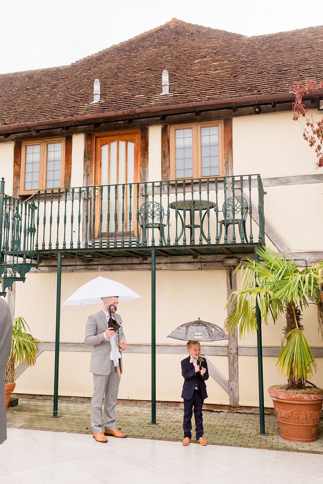 Rivervale Barn Court Yard rainy wedding