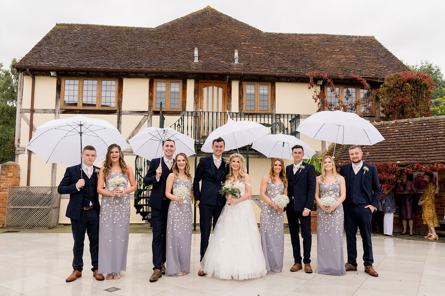 umbrella group photos rainy wedding