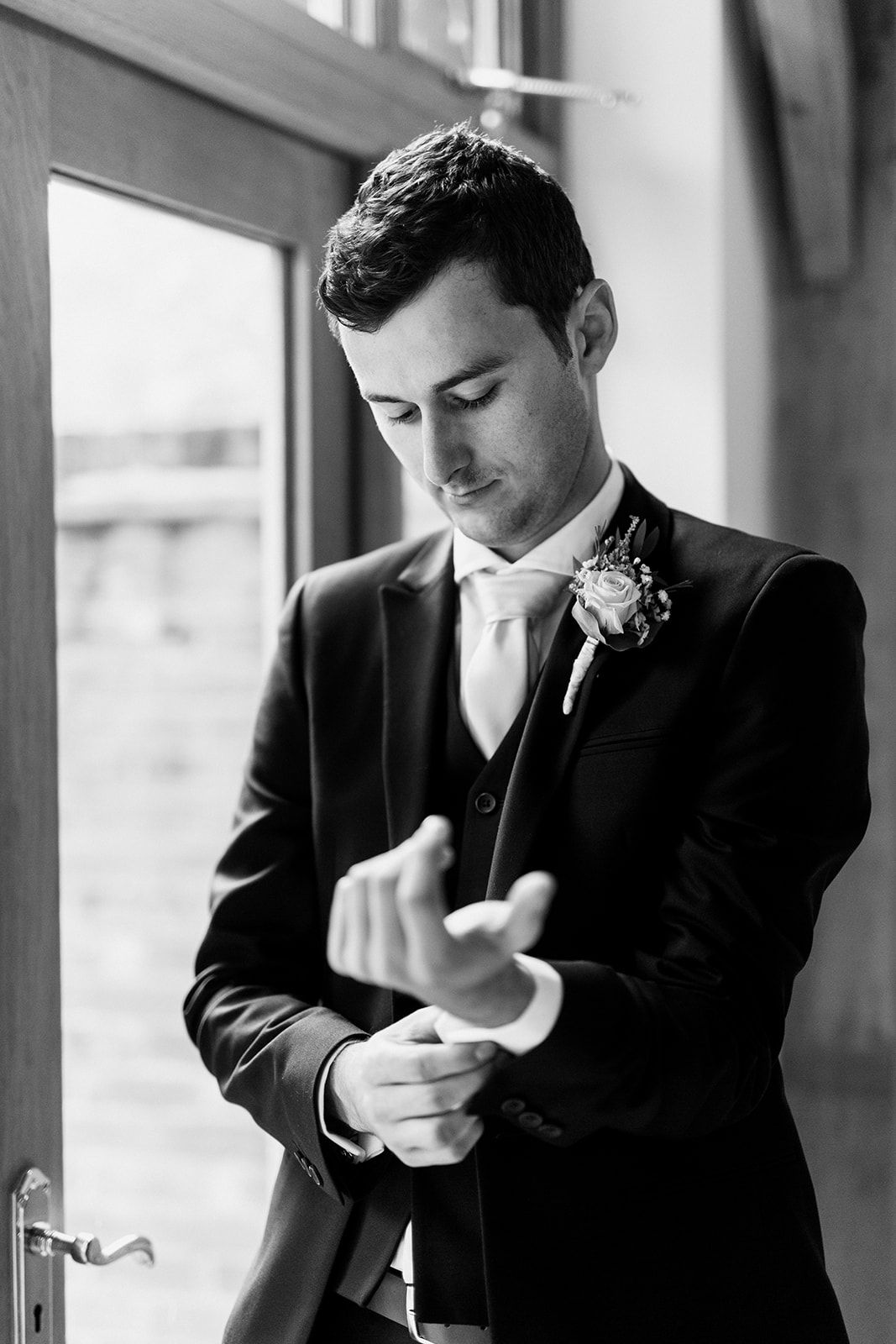 black and white photo of groom