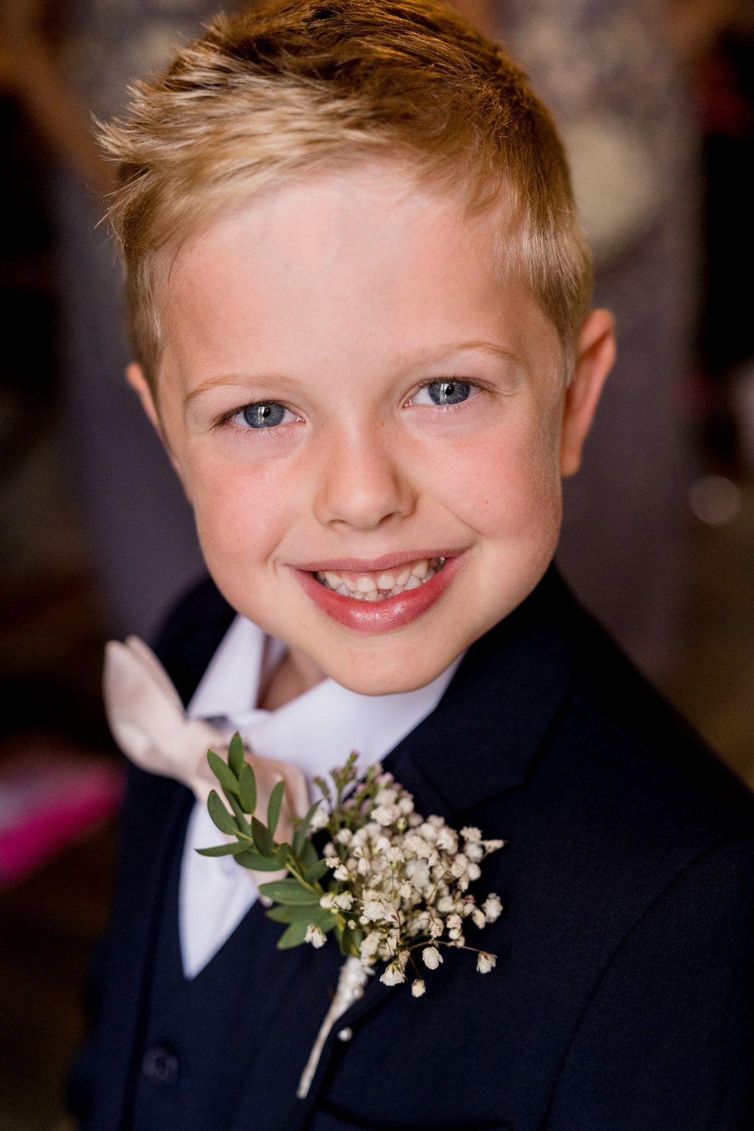 ring bearer with pink bow tie