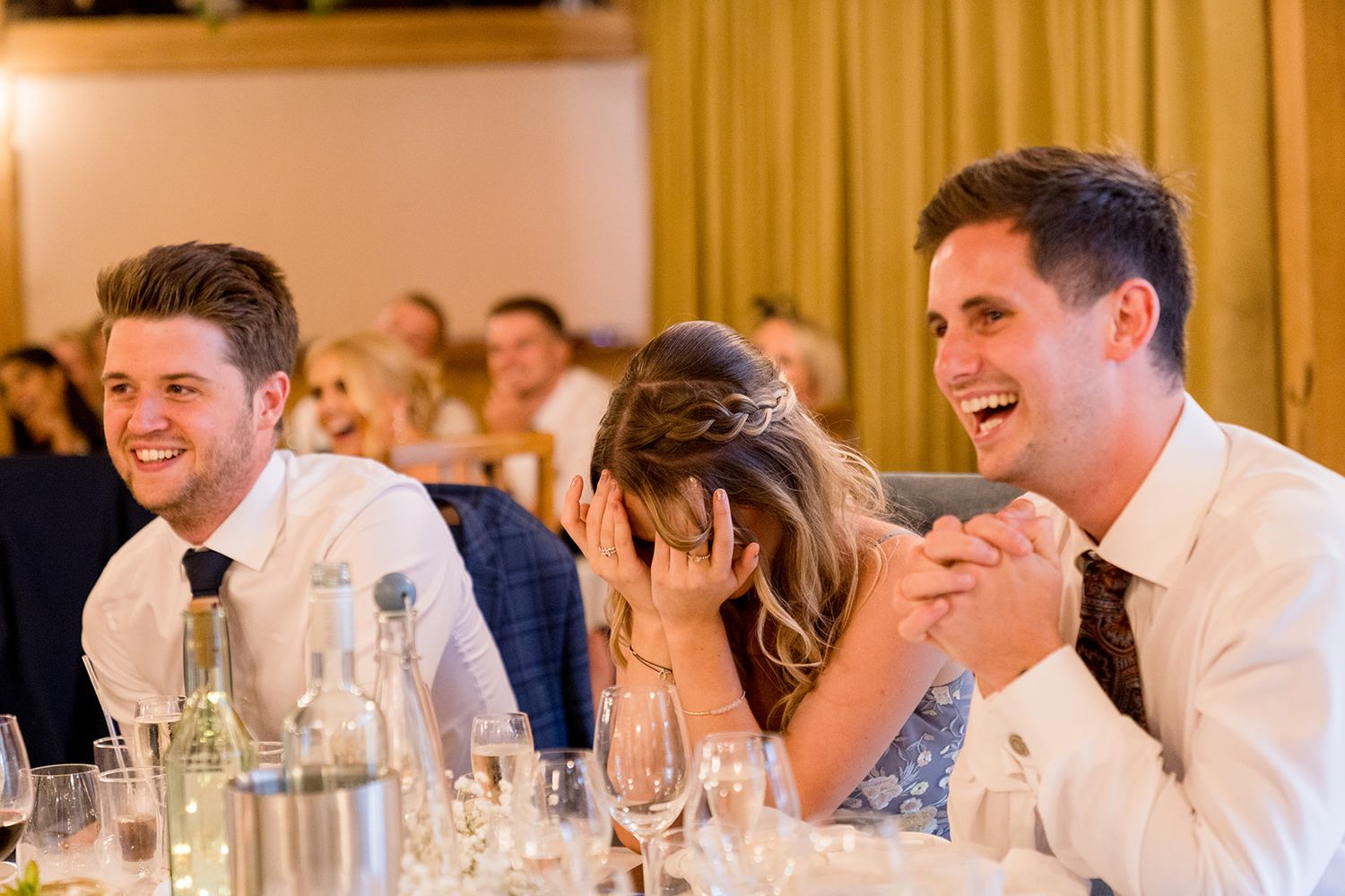 guests laughing at speeches