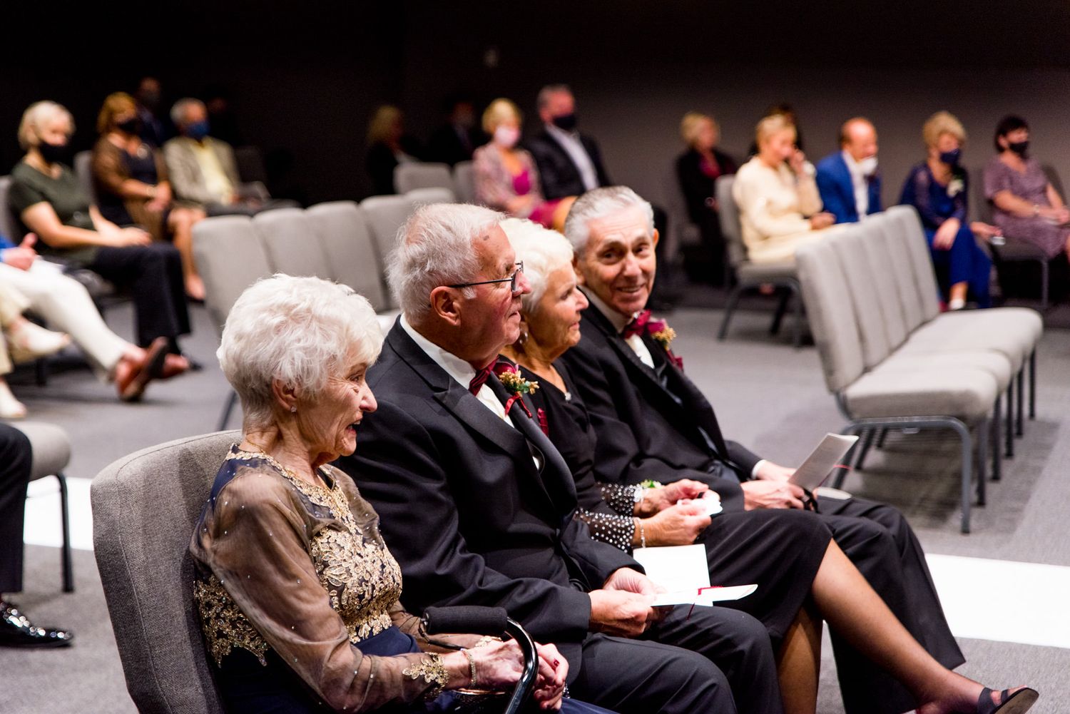 wedding guests in grey chairs converse, chicago wedding photography