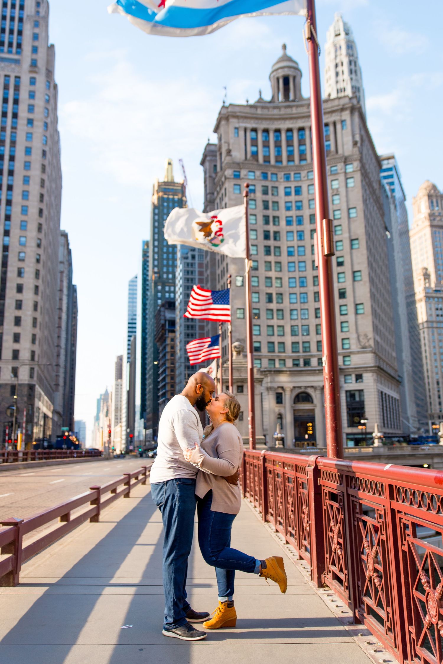 man and woman kissing on Dusable Bridge for Chicago engagement photos