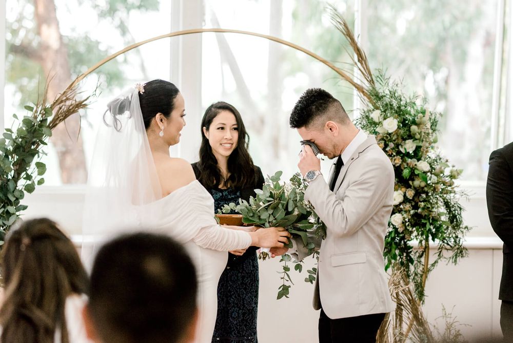 groom feeling emotional during wedding ceremony