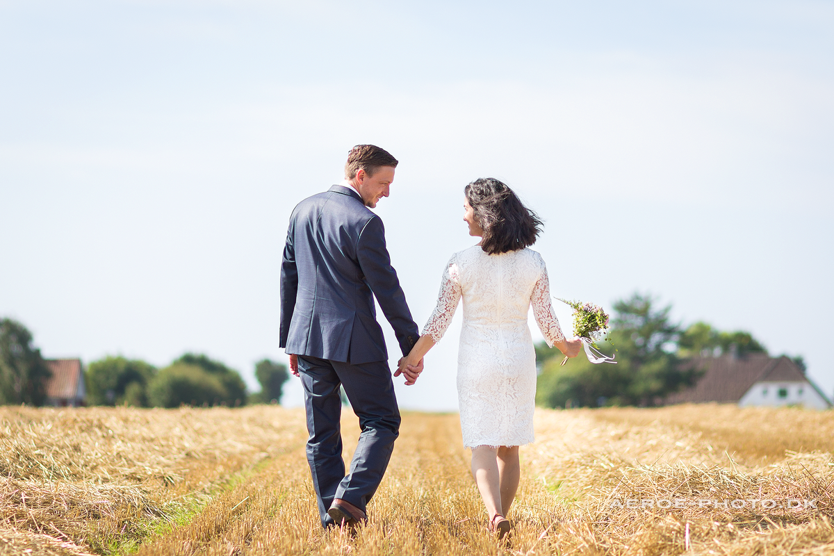 Happy wedding couple in the fields.