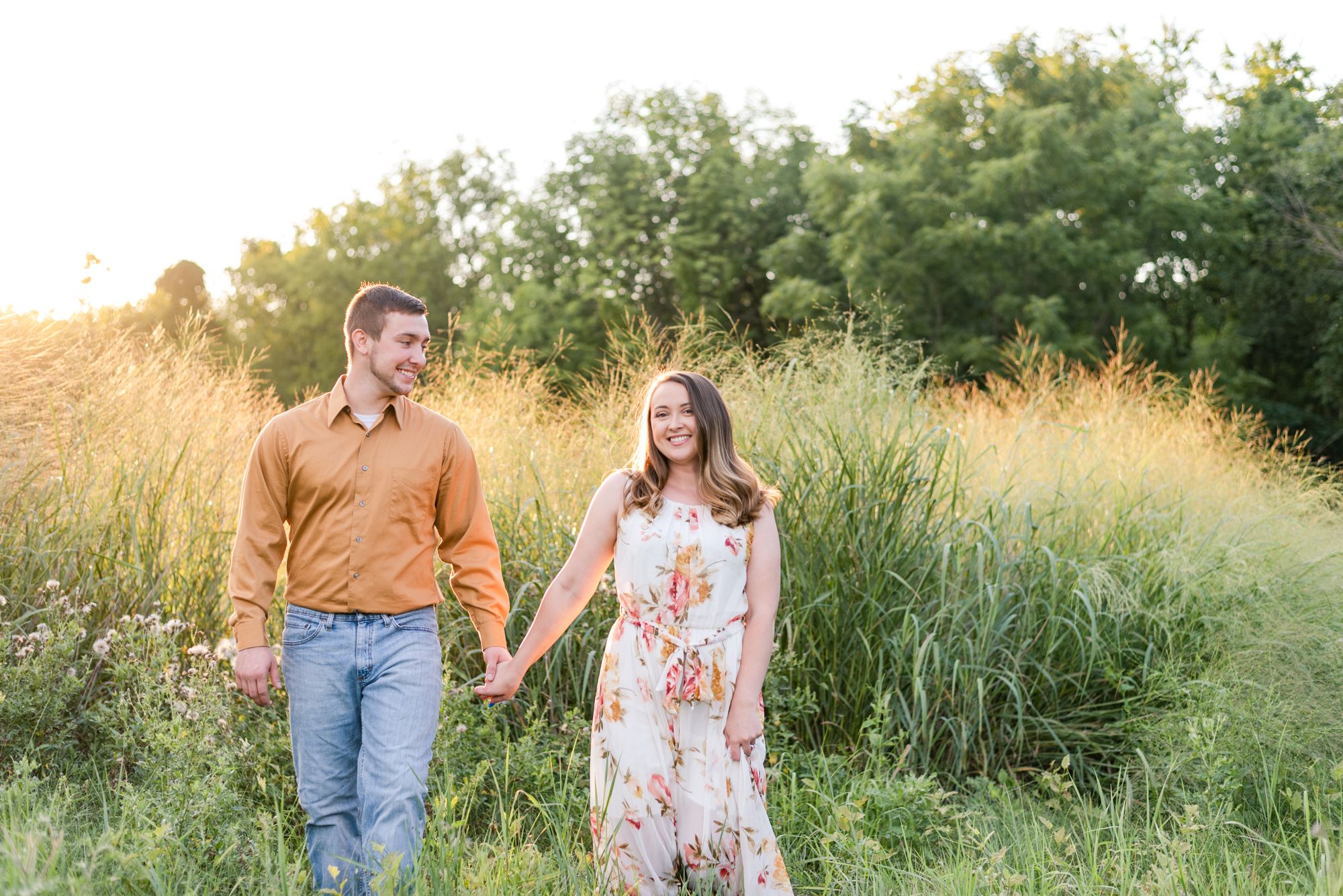 Engagement in tall grass at Moraine State Park in Pennsylvania