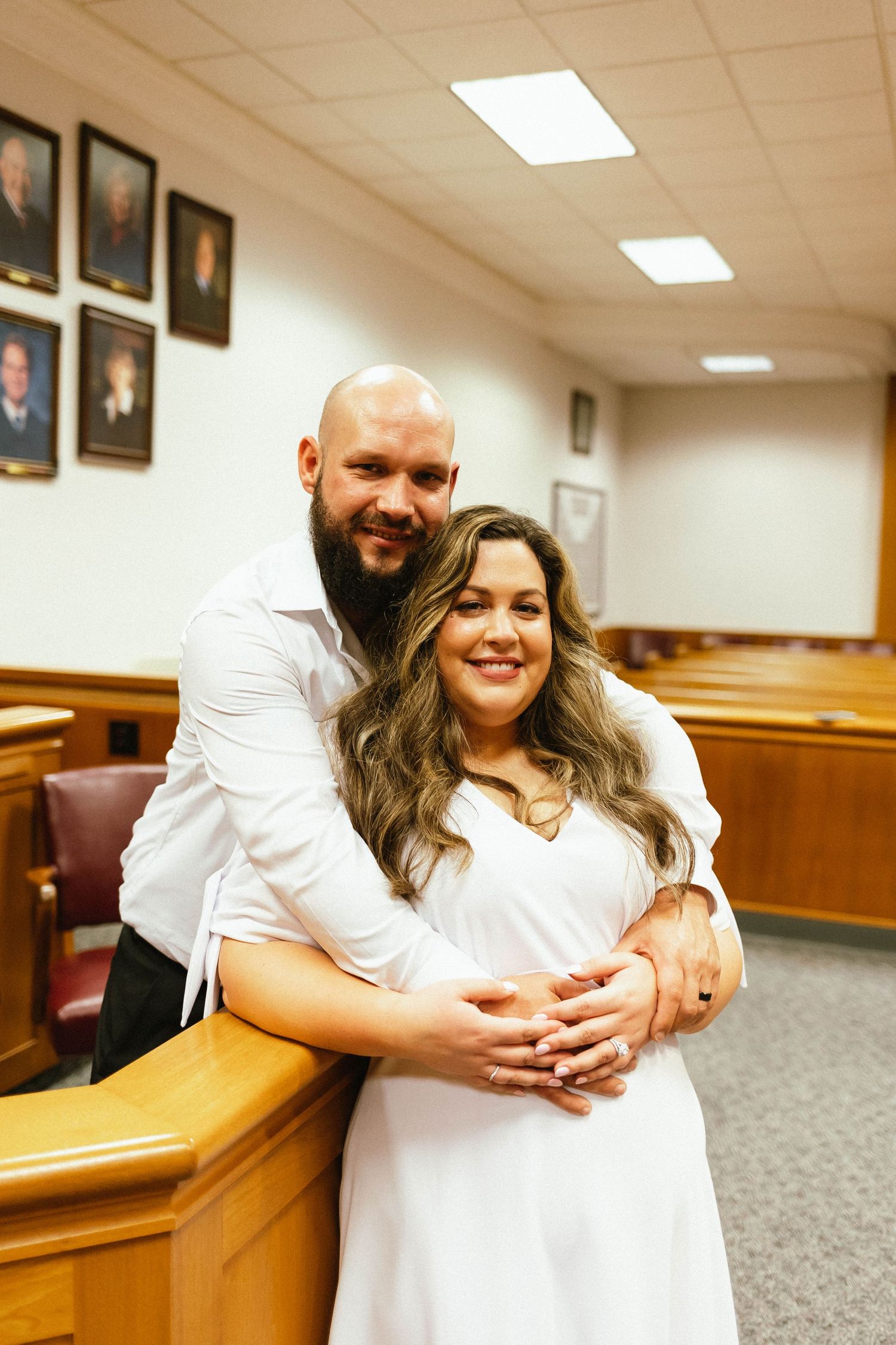Husband and wife pose for photos courthouse waukesha wisconsin