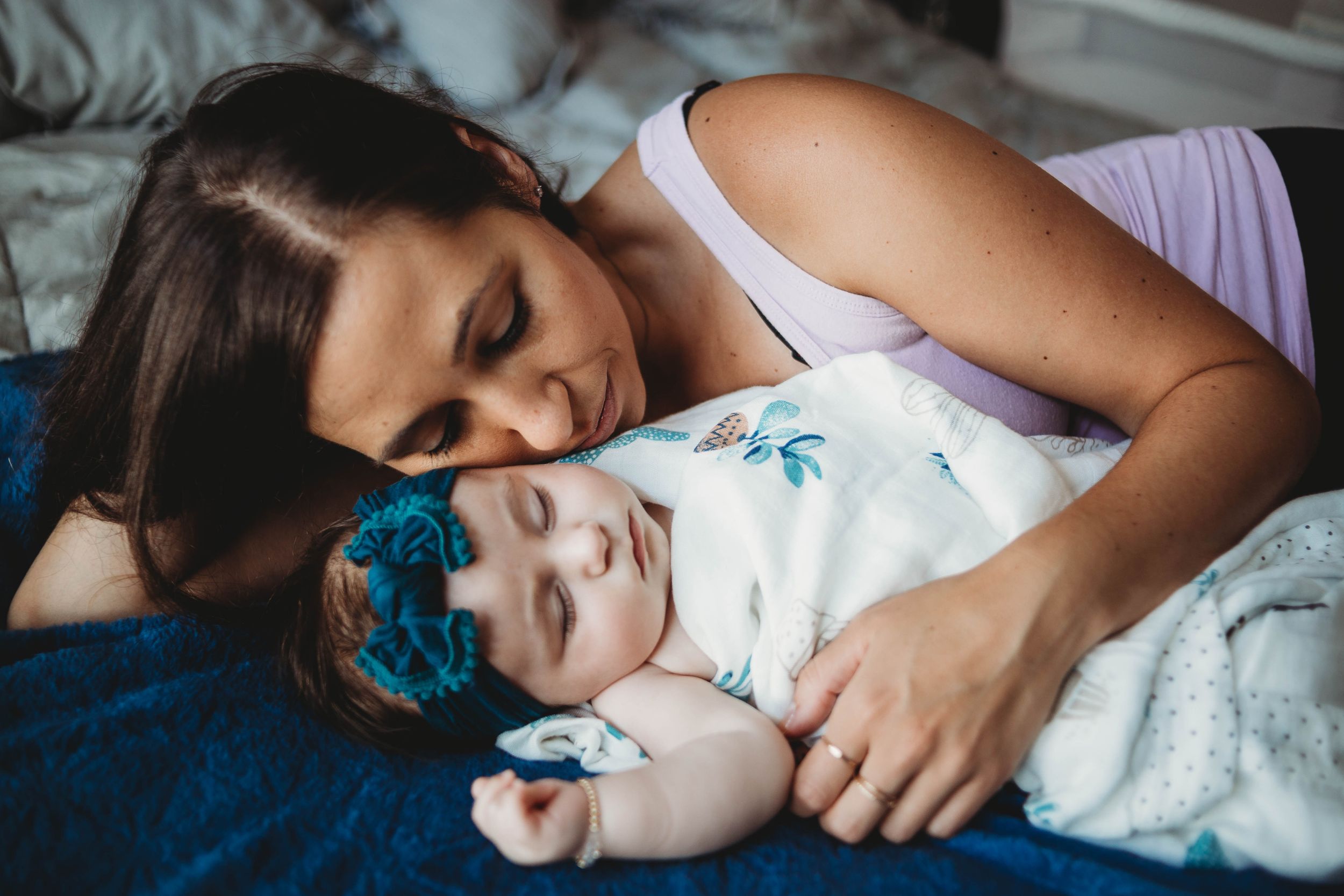 mom laying with her daughter by bolton photographer
