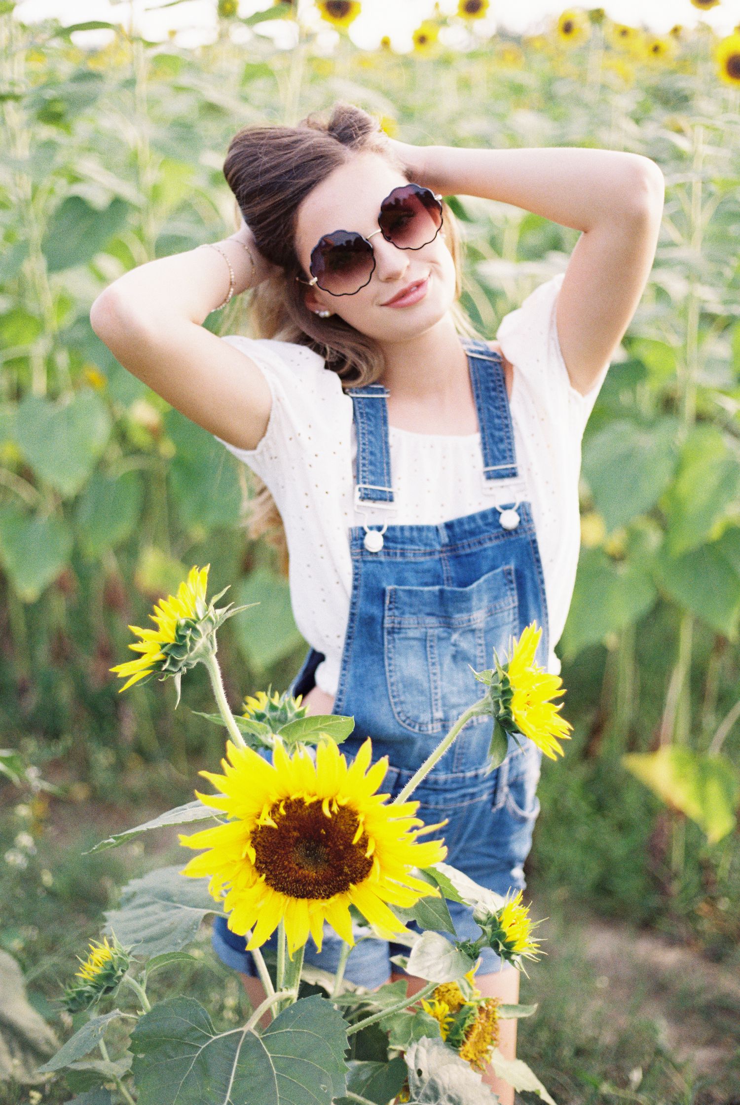 Louisiana senior portraits of a female Oak Forest Academy student at a sunflower field in Picayune, Mississippi