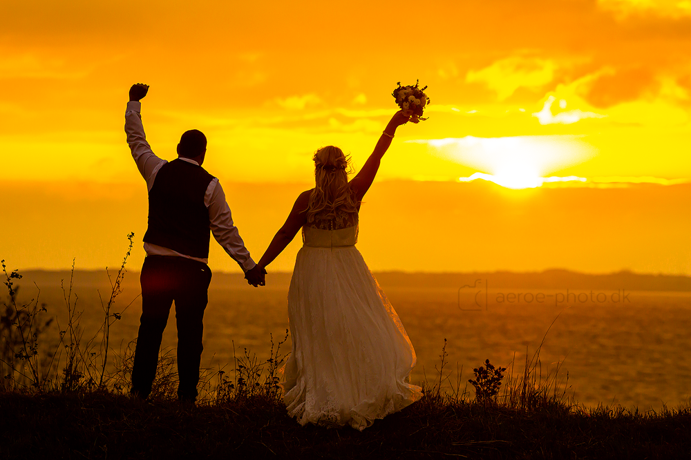 Wedding couple enjoying the sunset on the island Ærø