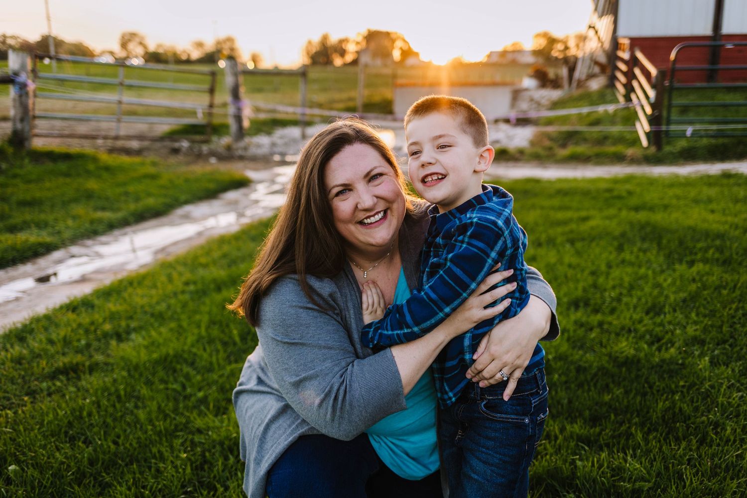Mom and son look at camera during a photoshoot with a lake country area photographer from hartland wisconsin.