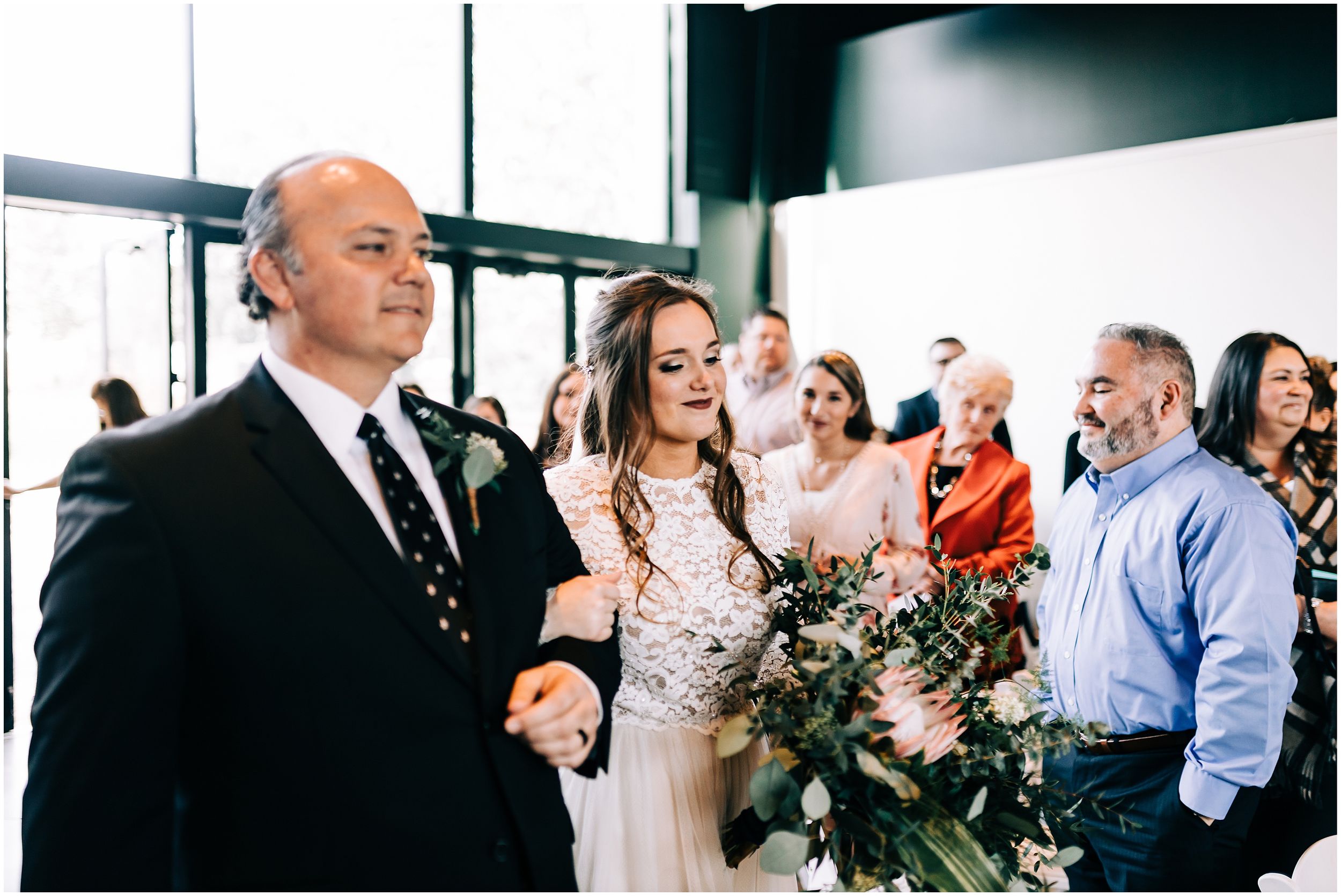 bride walking down aisle with dad