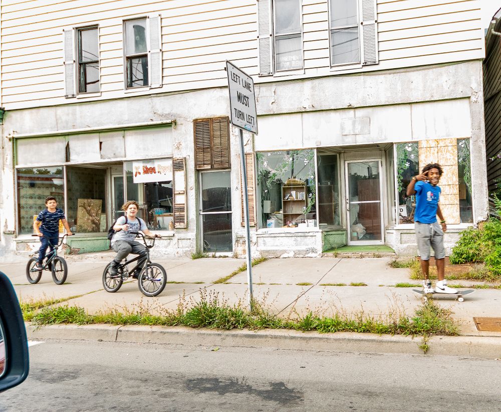 Street youths with lens cap cropped @ 8mm. Binghamton, NY