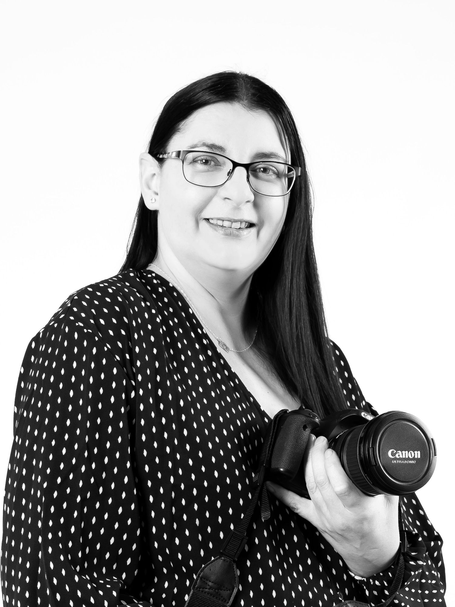 Sarah Booker black and white photo holding camera