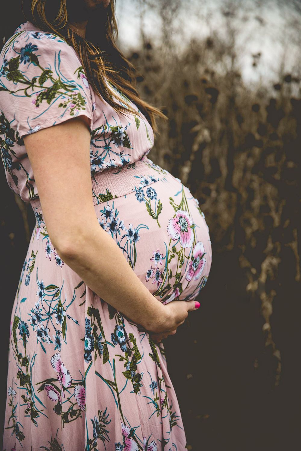 ellensburg maternity photograph of mother holding her baby bump and viewing from her profile