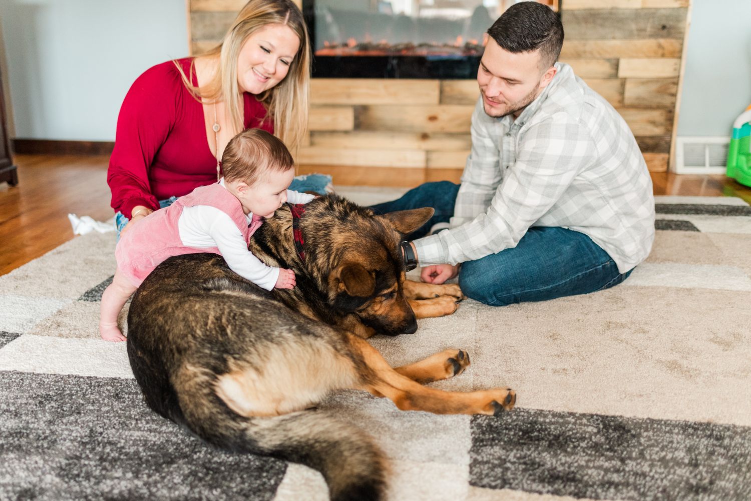 Lifestyle family photoshoot in the home with mom, dad, baby, and german shepherd in Gibsonia, Pennsylvania