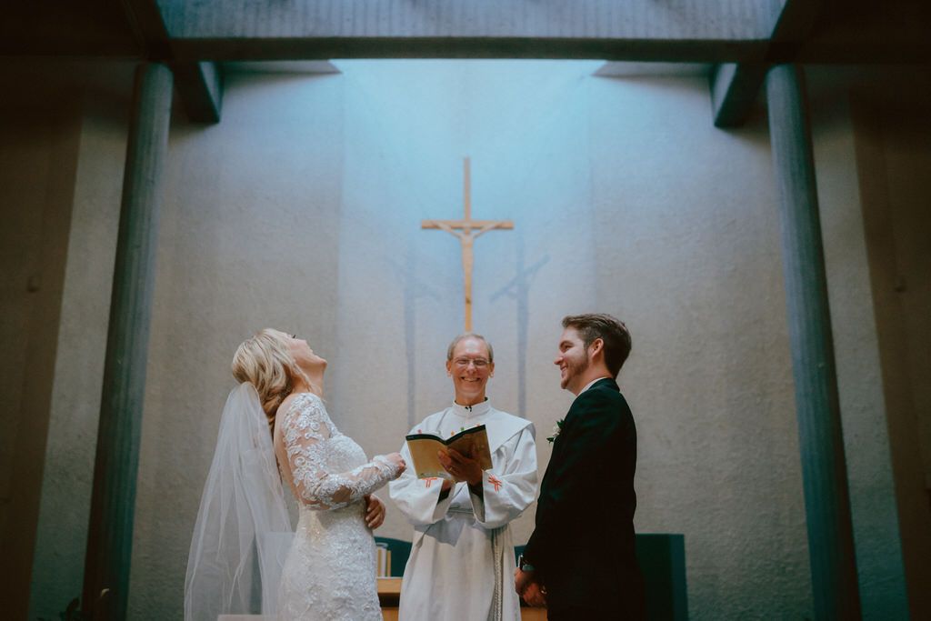 Bride and groom exchanging vows during a romantic outdoor wedding ceremony in Banff | Calgary wedding photographers.