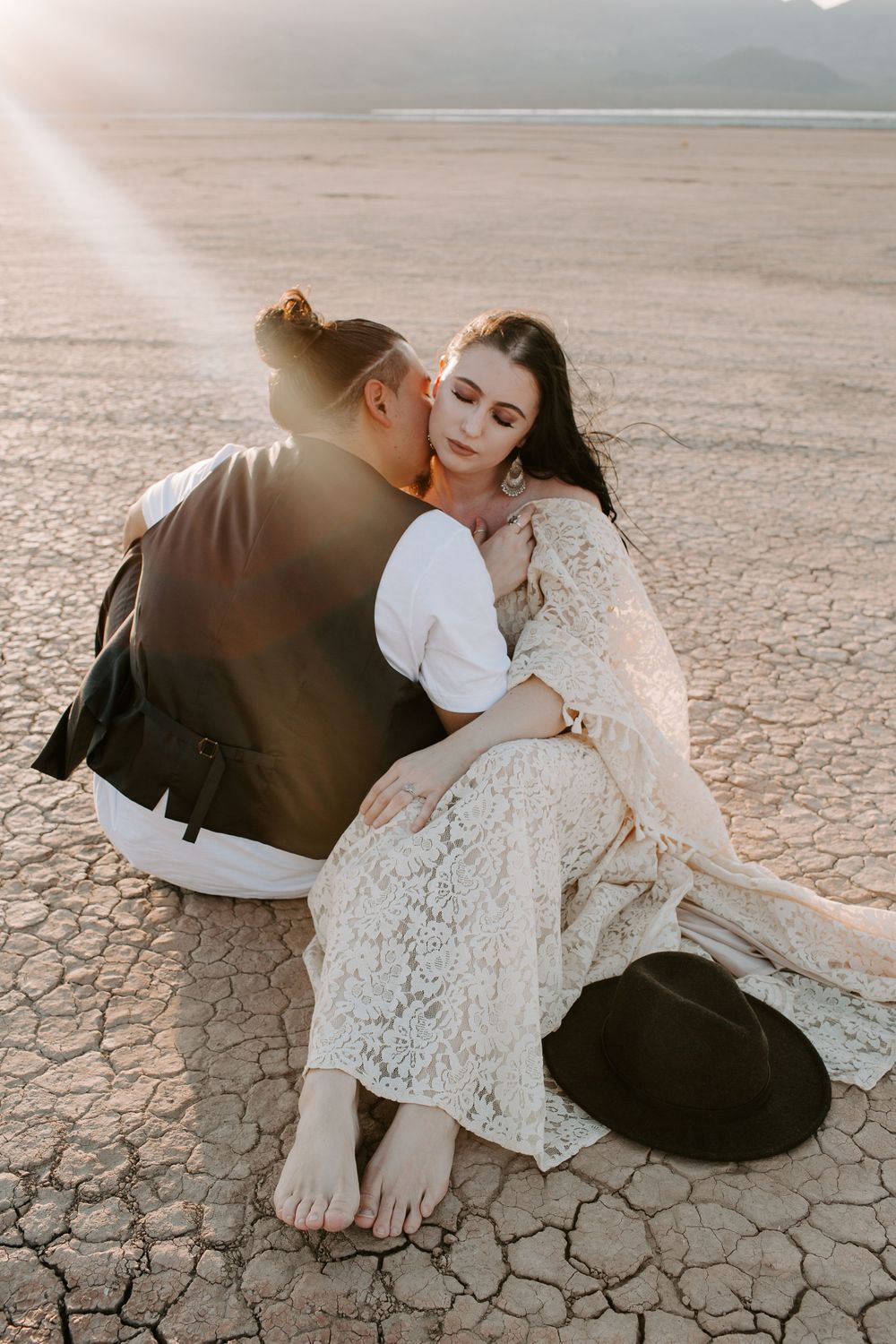 couple sitting on a dry lake bed in Las Vegas