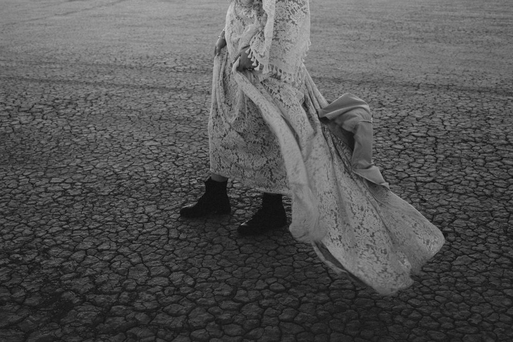 women's boots on a dry lake bed