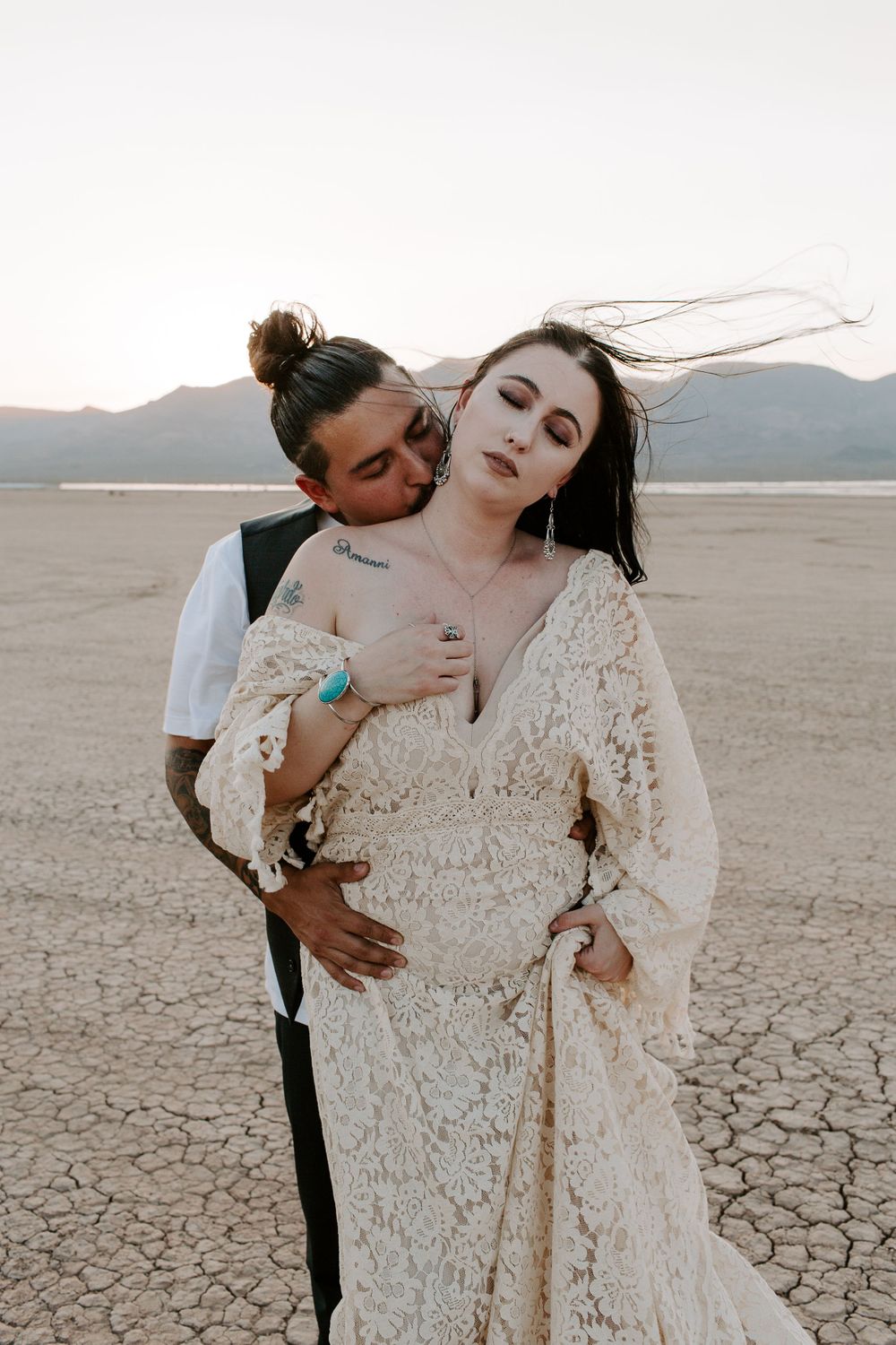 man kissing his wives neck near Las Vegas