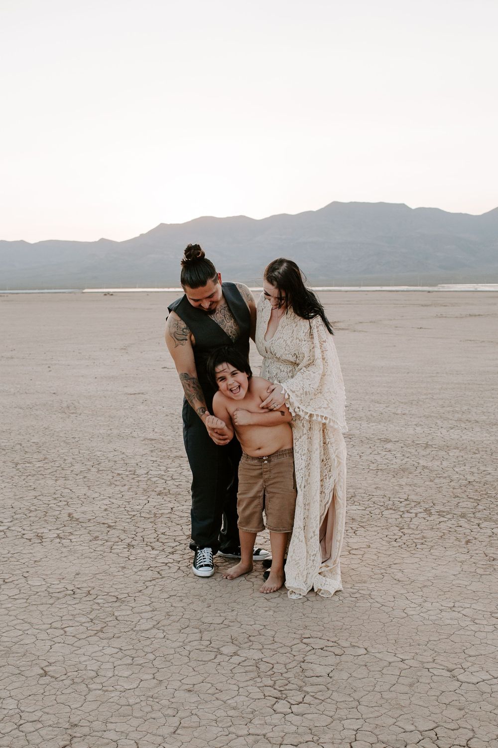 couple tickling their son during their Las Vegas elopement