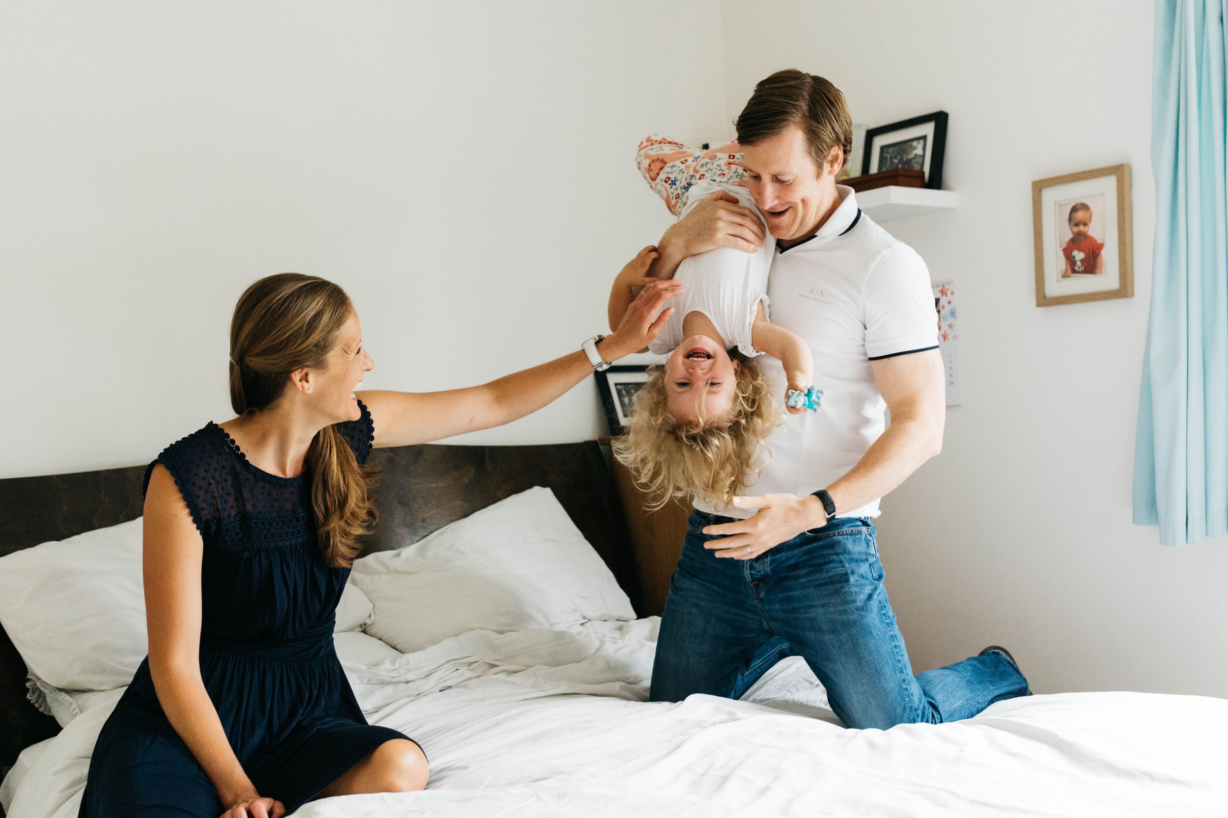 walthamstow family of three joking on bed