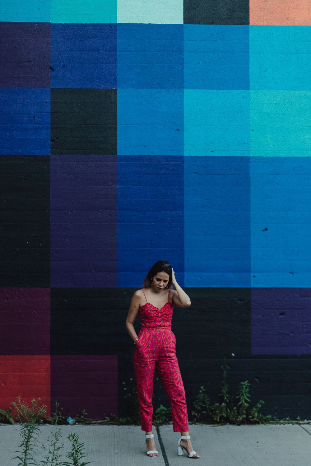 Woman standing by graffiti wall West Loop Chicago portraits lifestyle session