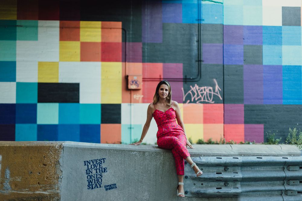 Woman standing by graffiti wall West Loop Chicago portraits lifestyle session