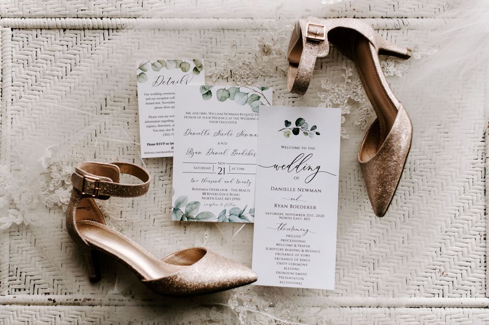 Styled wedding detail shots of invitations and shoes