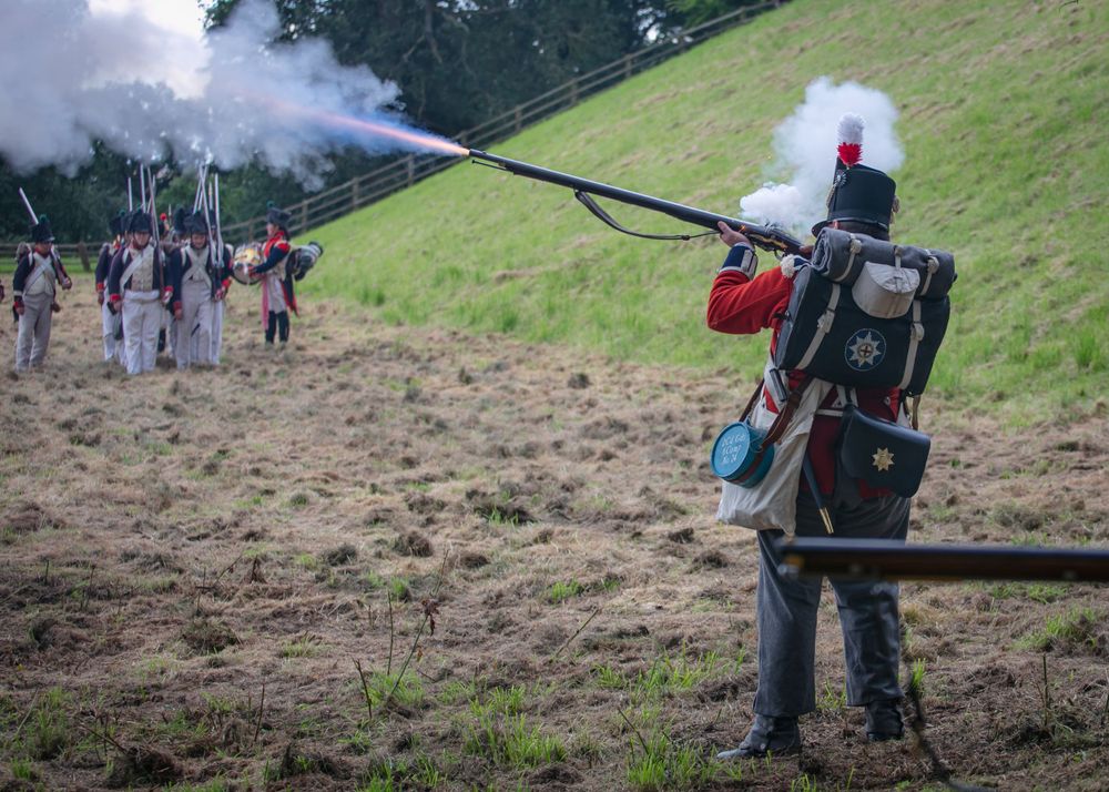 A British red coat napoleonic soldier firing a musket rifle at Belvoir Castle