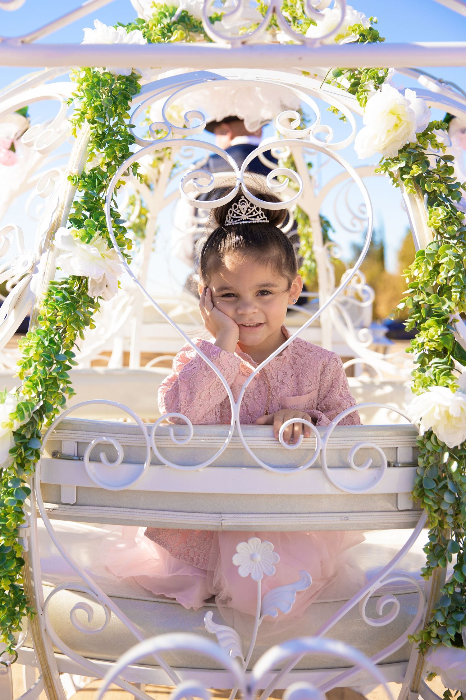 little girl posing in the back of the horse carriage