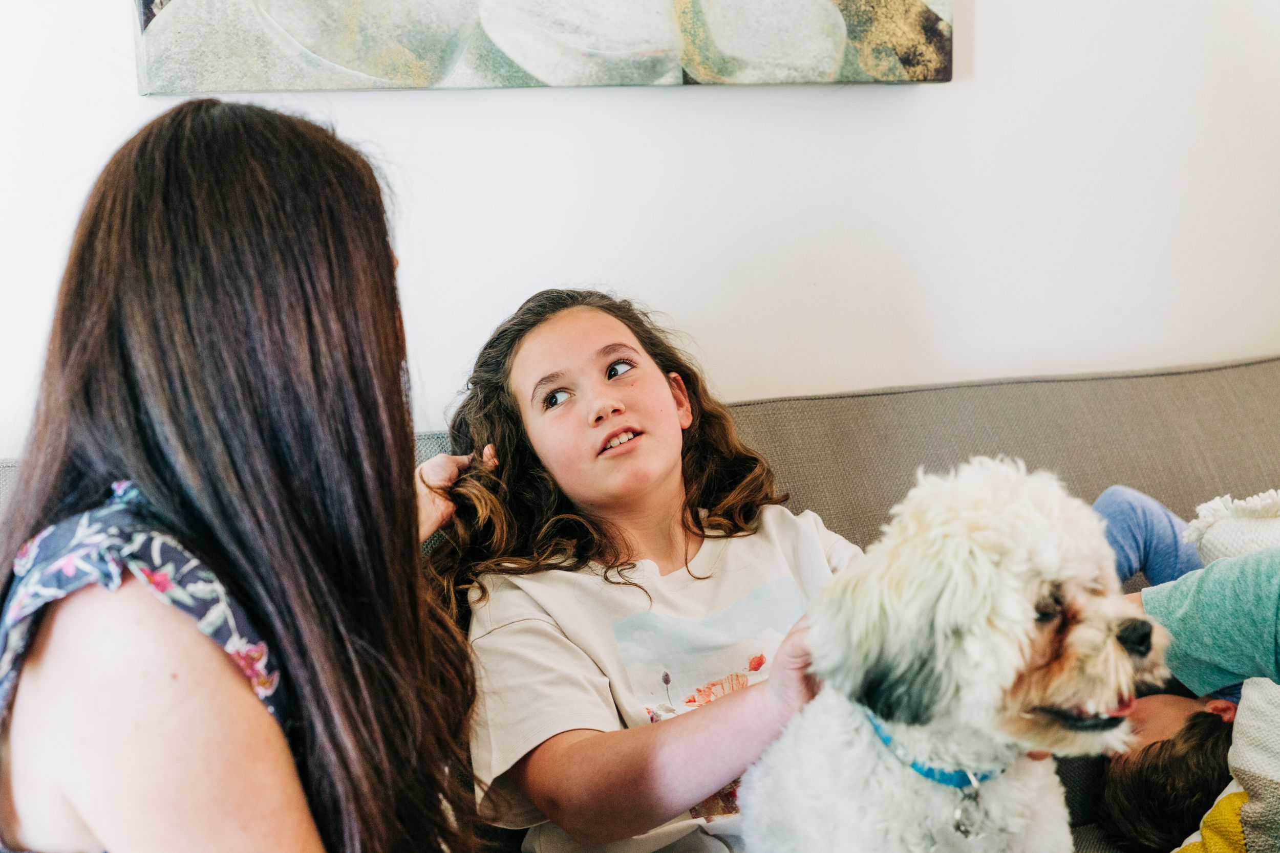 A tween girl looking and talking to her mother