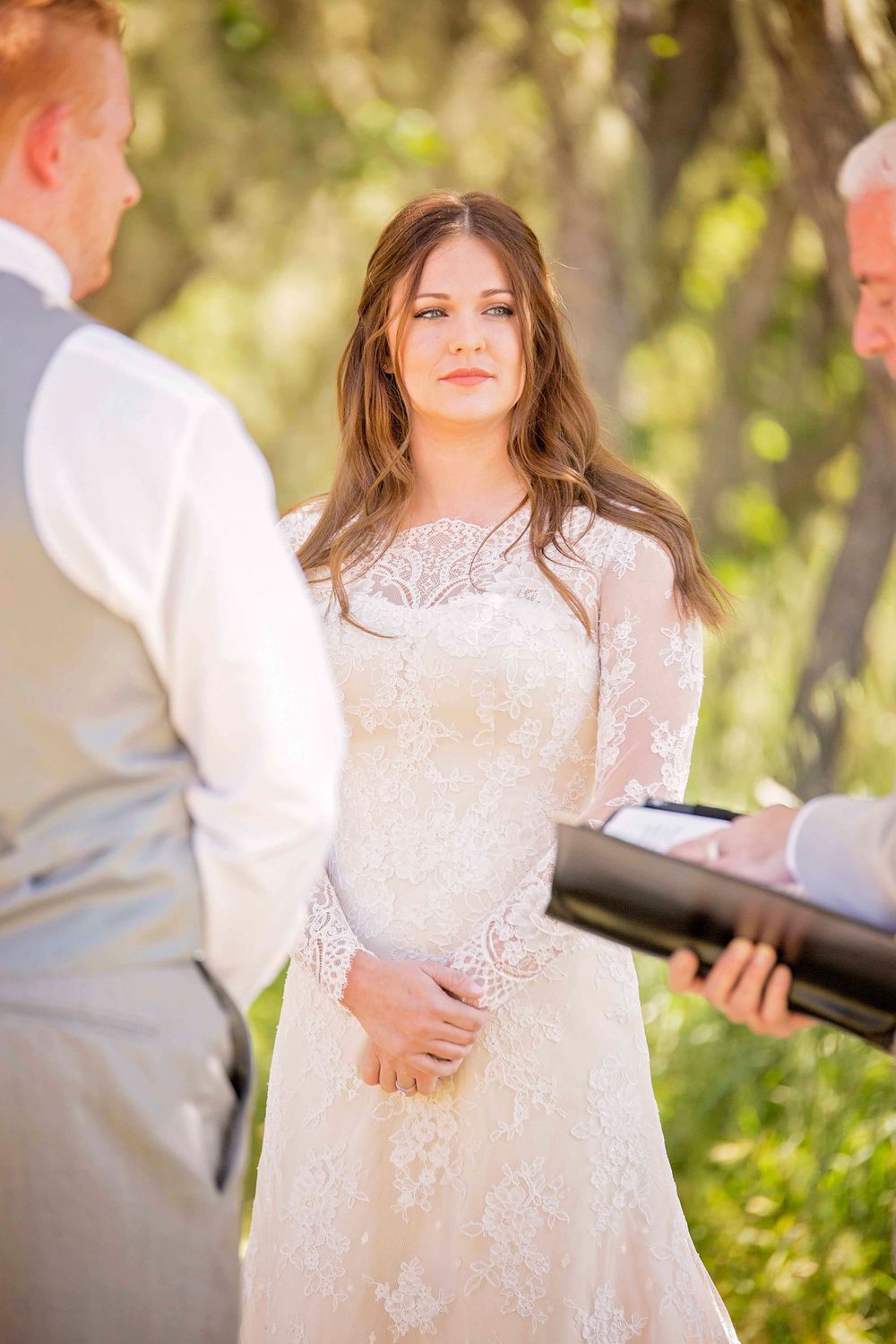 bride looking at the officiant during the wedding