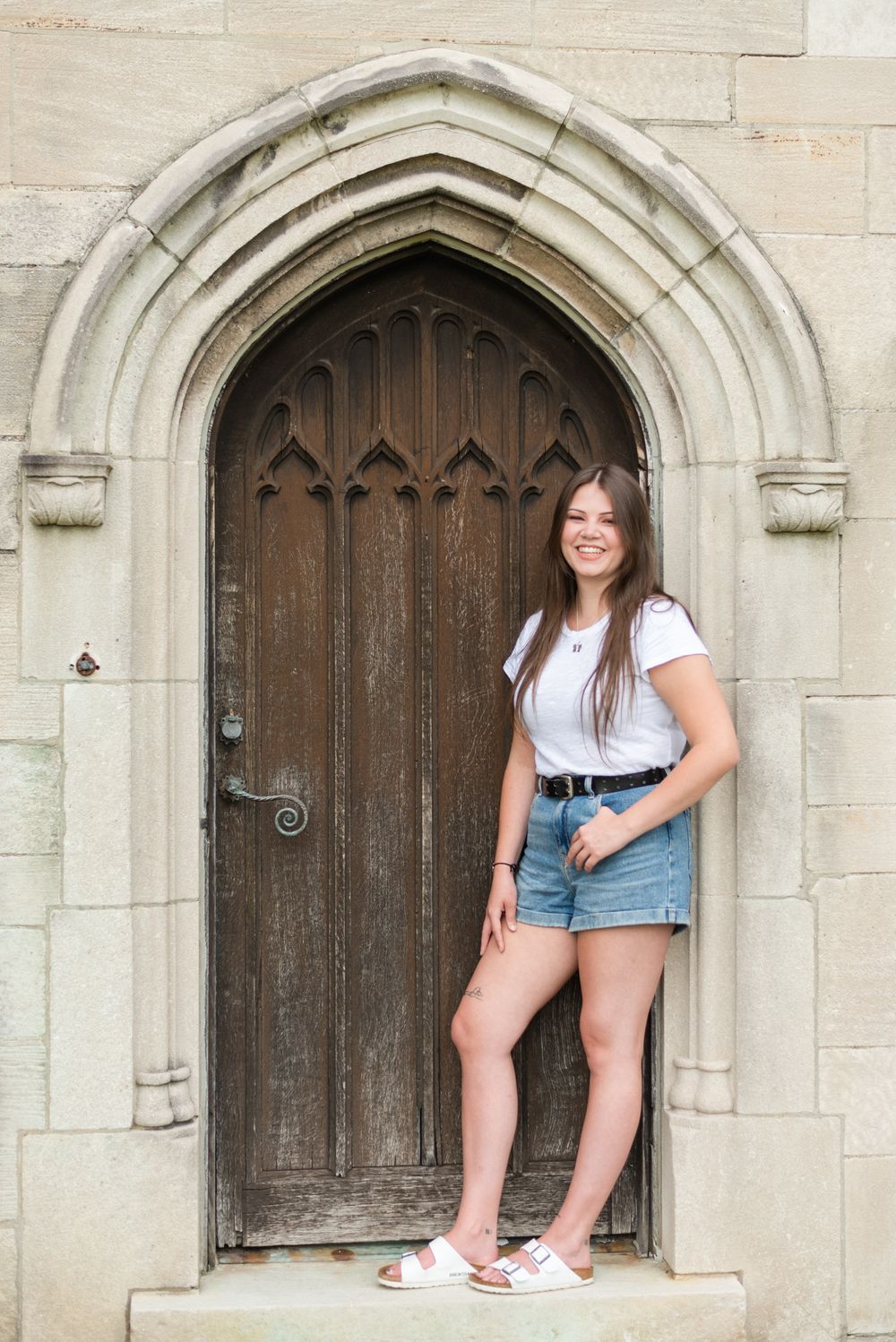 Girl laughing in old doorway at Hartwood Acres in Pittsburgh Pennsylvania