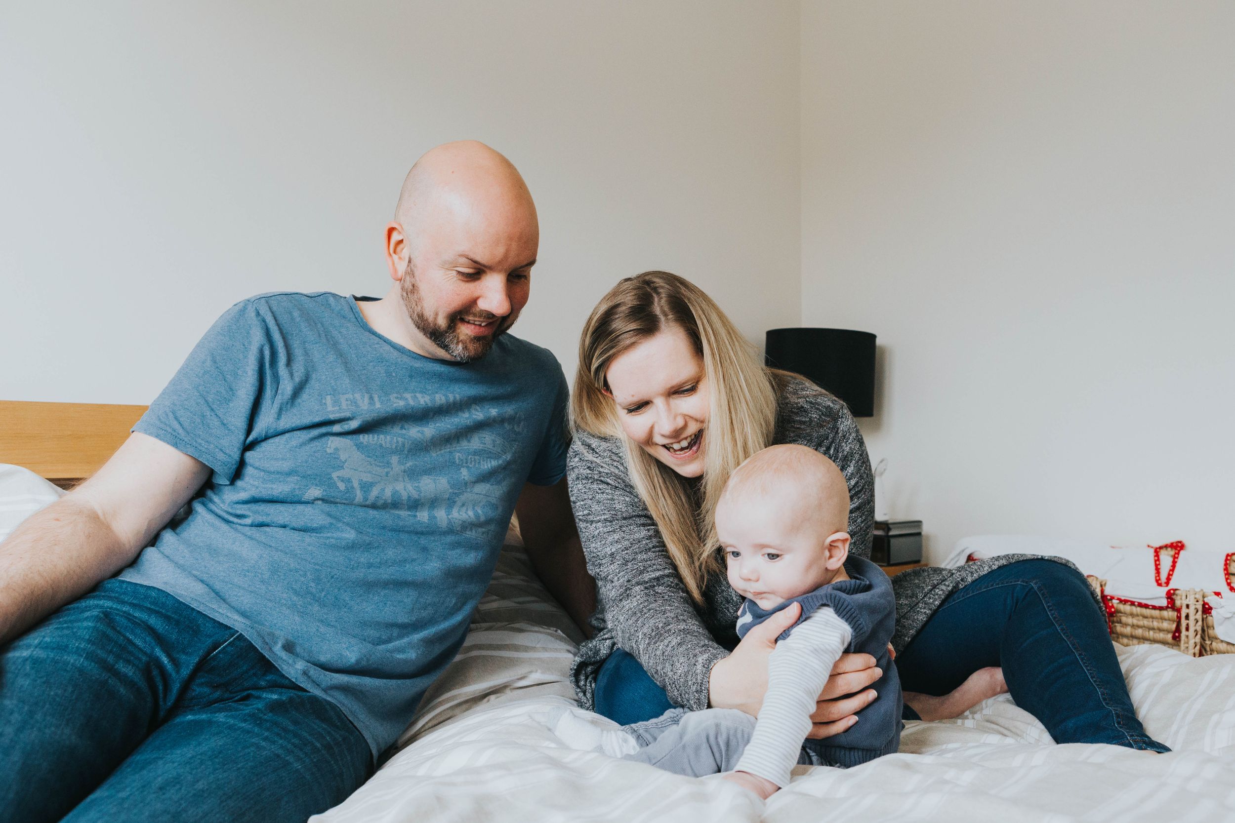 Family documentary at home photo shoot with a little baby boy and his parents.