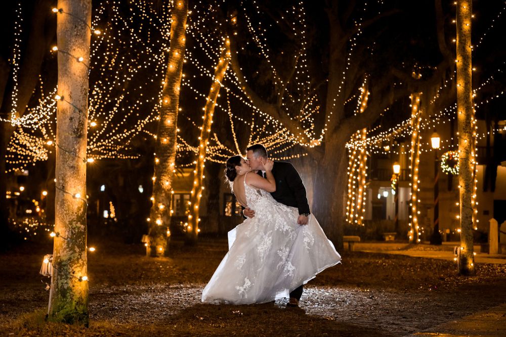 Married couple kissing under Night of lights St. Augustine by Jay Grubb Photography