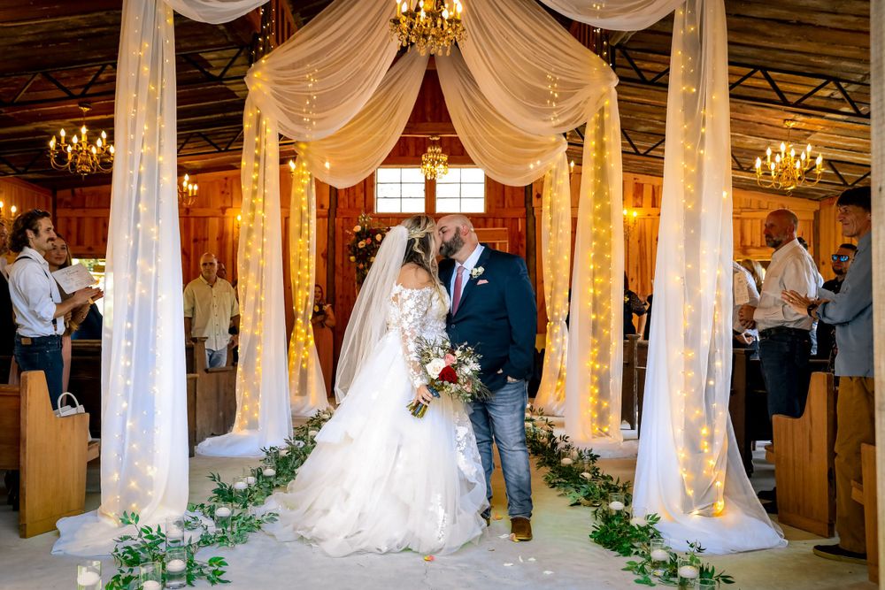 Married couple wedding celebration kissing just married by Jay Grubb Photography