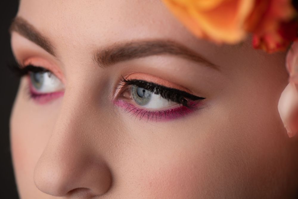 liquid eyeliner, pink and orange eyeshadow