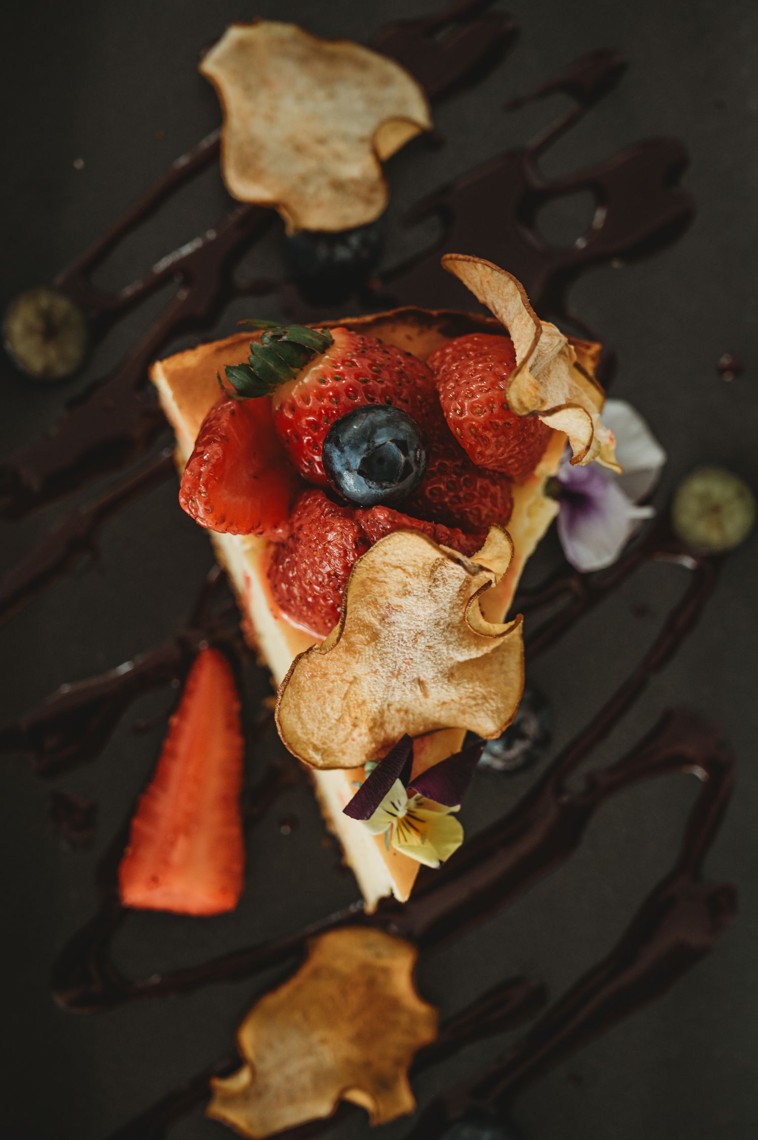 Close up of a slice of cheesecake that has been beautifully decorated with fruit. SIX84 Photography, Food Photography, Sydney