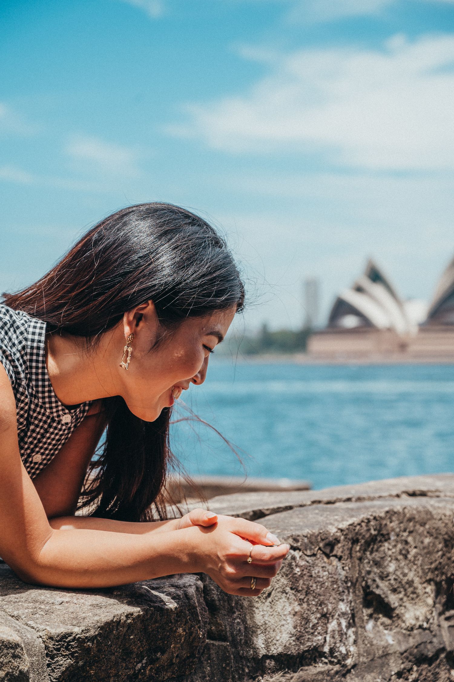 Female model smiling with Sydney Opera House and Harbour in the background. SIX84 Photography, Portrait Photography, Sydney