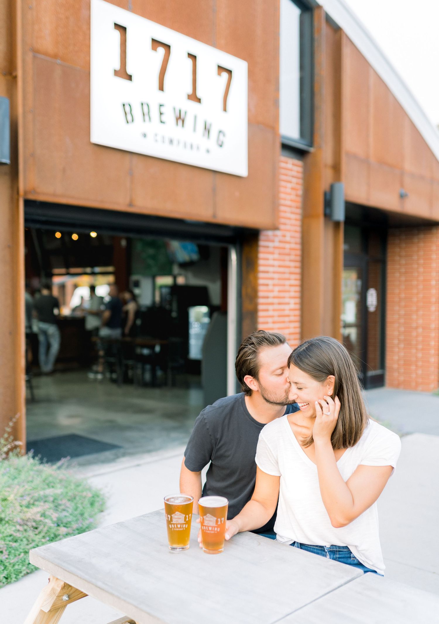 Des Moines Engagement photos at brewery in downtown Des Moines, Iowa with light and airy photographer Nicole Laing