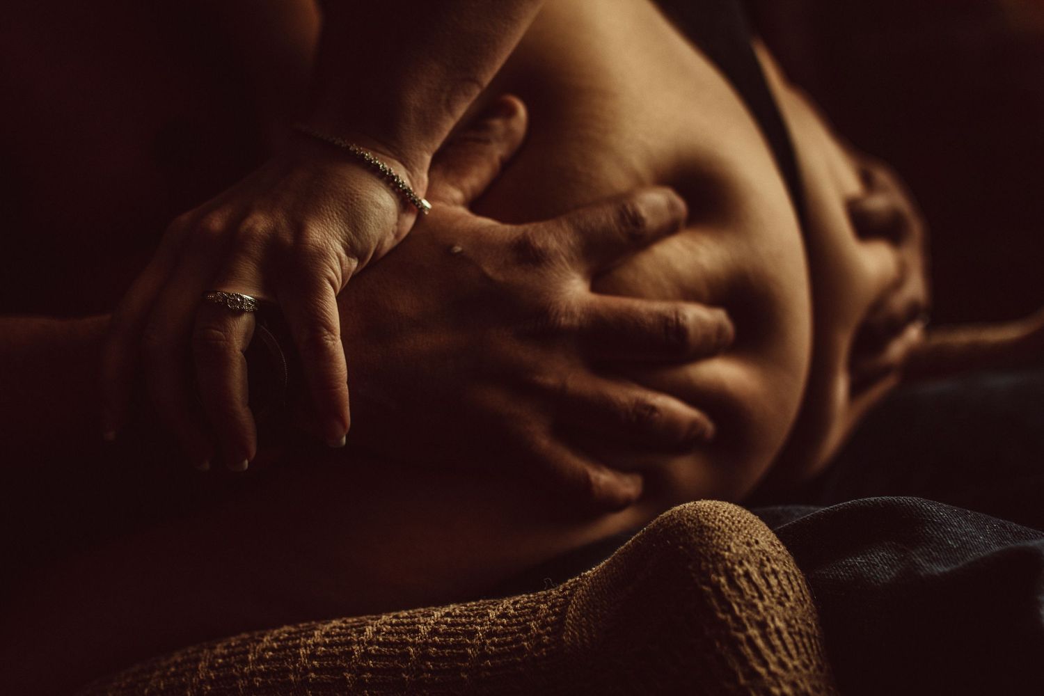 image of husband grabbing wife butt posed for boudoir couple photos at studio in Dallas TX
