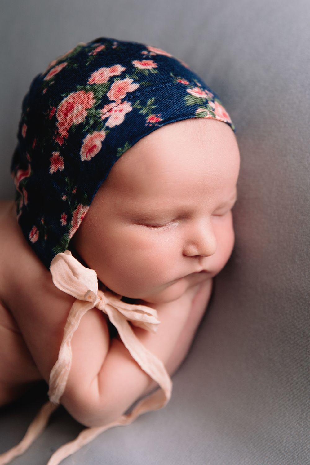 baby girl sleeping on blue blanket for newborn photoshoot in raytown mo
