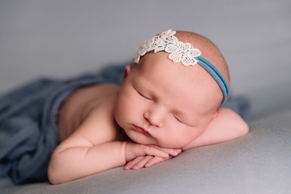 lee's summit missouri professional newborn photography studio baby girl sleeping on blue blanket